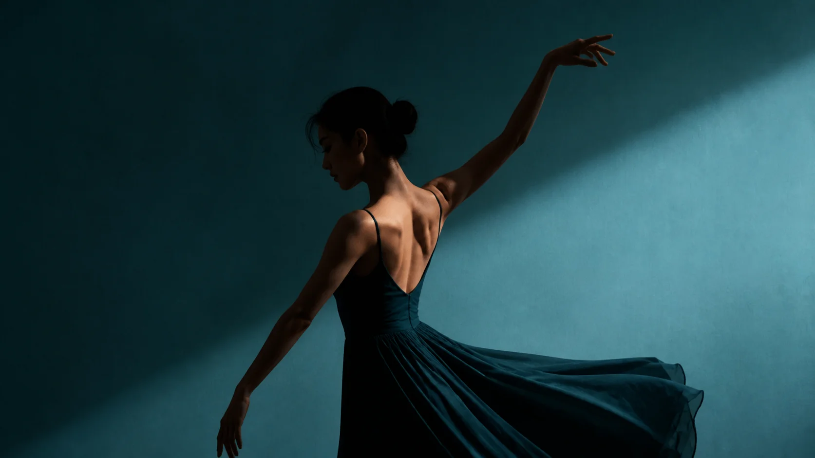 Scene key frame — dancer against a teal studio wall in a single hard light